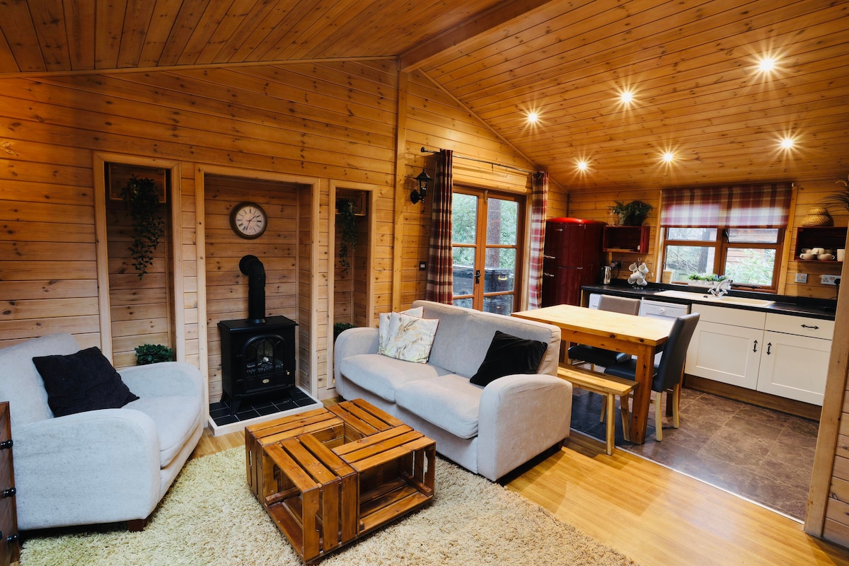 Cabin surrounded by woodland